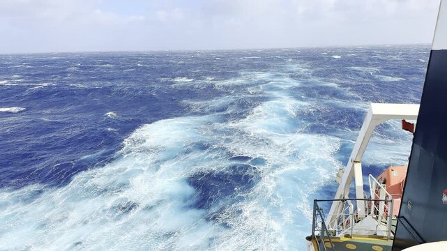 propeller jet of the cargo ship proceeding in heavy storm in a ocean. spectacular marine energy driven through changing global climates. drive dynamic liquid mountains across vast watery expanses