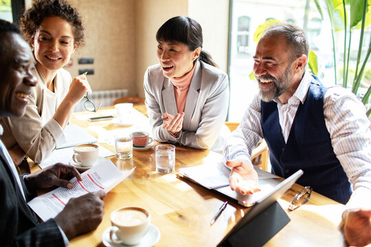 Diverse business team meeting in a cafe