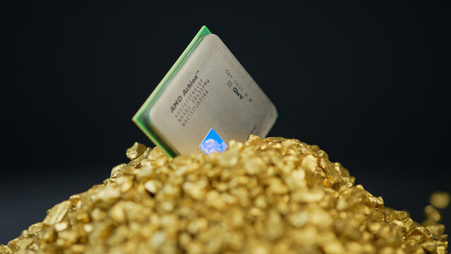 AMD CPU Central Processing Unit of the computer in the pile of gold. Concept of AI boom triggered shortage of CPUs, components for data centers: Toronto, Ontario, Canada - March 24, 2026