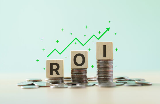 Return on investment concept with ROI letter blocks stacked on coin columns and an upward graph arrow, illustrating financial growth, profit performance, business success, and investment strategy.