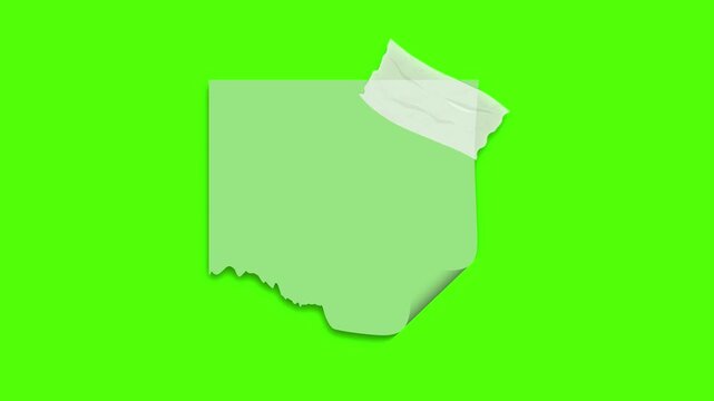 Memo Note With Paper Tape: A single memo note, attached with paper tape, floats against a vibrant green backdrop, its edges slightly torn, hinting at a story yet to be written. 