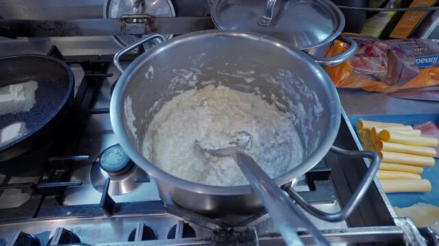 Hot Porridge in Cooking Pot on Galley Stove