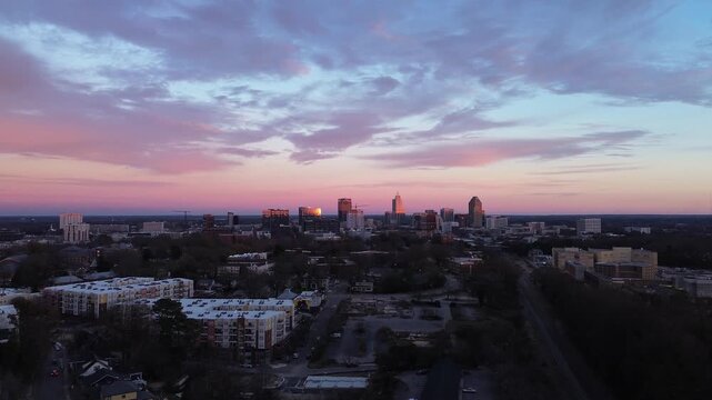 Aerial view of downtown Raleigh at sunset looking East