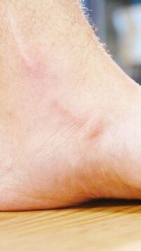 Flat feet forcing arch up exercise close-up