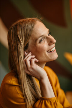 Smiling blonde woman enjoying a moment of happiness