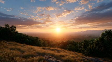 Obraz premium Golden hour sunlight paints the rolling hills and dense forest canopy beneath a dramatic colorful sky at sunrise or sunset