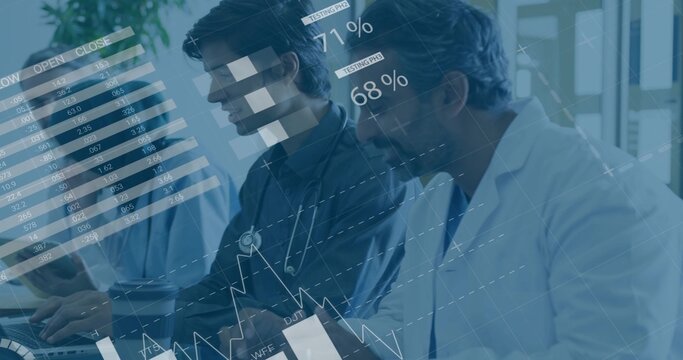 Analyzing team in lab coats, scrubs reviewing data overlays at desk with laptop and stethoscope