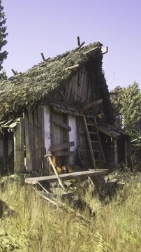 A rustic, weathered cottage stands alone in a lush forest. With moss covered thatched roof and broken wooden beams, it tells stories of the past.