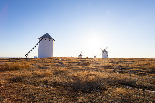 Campo de Criptana windmills standing on a dry Castilian plain