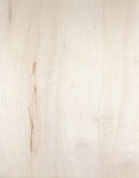 Pale birch plywood wood texture with subtle natural grain pattern.