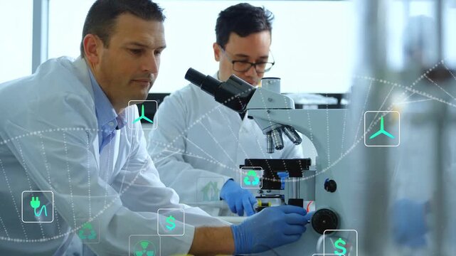 Two researchers leaning into scope, placing slide at lab, causing teal energy icons for analysis