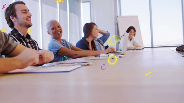 Six coworkers at table during business meeting, camera panning, group turning to animated numbers