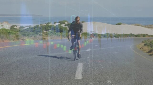 Male cyclist pedaling toward camera on coastal road, finance waveform and candles tracking training