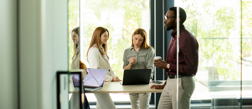 Group of people having a meeting in a modern office during daytime hours