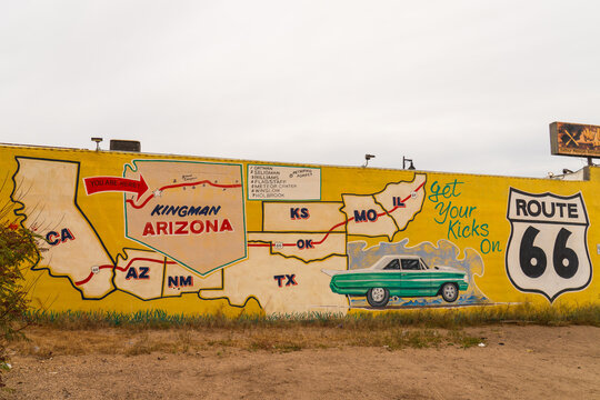 Kingman, Arizona, USA - April 6th 2026: A colorful Route 66 mural in Kingman, Arizona, features a map of the historic highway, a vintage green car, and the iconic "Get Your Kicks on Route 66" slogan