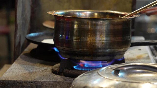 Cooking Pot on Gas Stove with Blue Flame