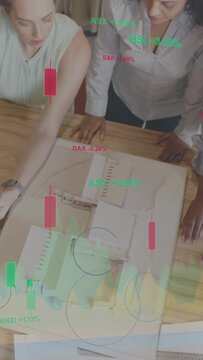 Vertical video: Team tapping phone, leaning over table, revealing AR market charts to assess costs