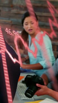 Vertical video: Man grabbing DSLR testing photography, neon pink scribble overlay obscuring faces