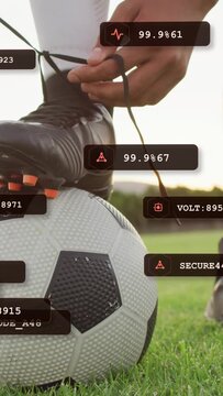 Vertical video: Soccer player touching lace looping pulling tying while HUD stats overlay cleat