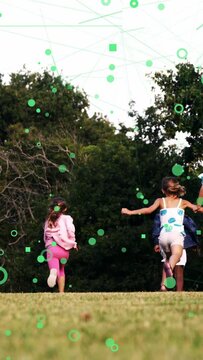 Vertical video: Kids running up hill to trees for play, green overlay linking kids for education