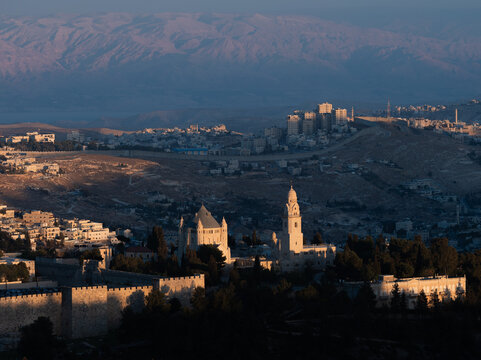 Jerusalem panorama with Judean Desert and snow mountains at horizon