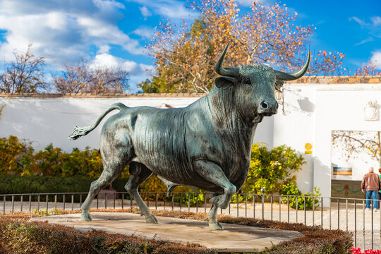 RONDA, SPAIN - DECEMBER 17, 2025: The majestic &lsquo;Monumento al Toro&rsquo; sculpture celebrating Spain's traditional bullfighting culture at the entrance to the historic bullring
