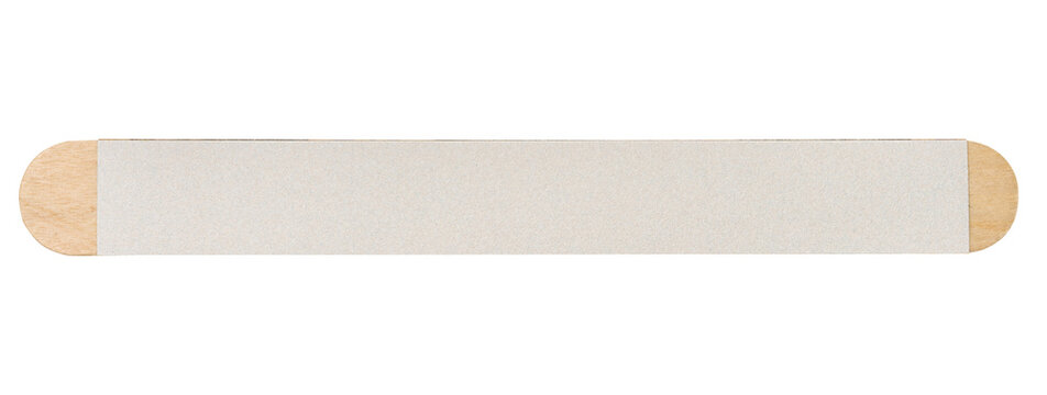 Nail file on a wooden base with a white fine-grained abrasive coating