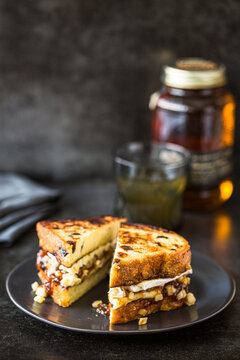 Grilled cheese sandwich on dark plate
