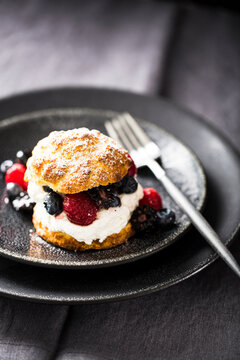Berry shortcake on dark dishes