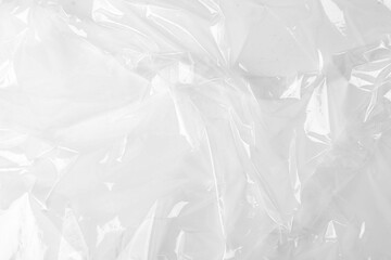 Obraz premium Transparent plastic wrap on white background, top view