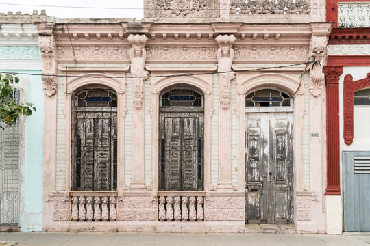Cuba, Cienfuegos.  Weathered front of colonial era building.