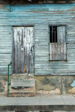 Cuba, Cienfuegos.  Weathered front of old wooden building.