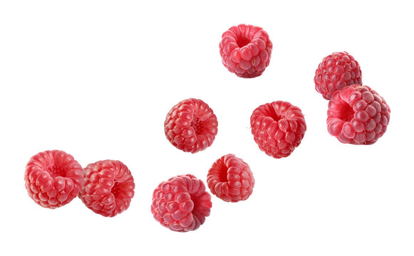 Fresh ripe raspberries flying in air on white background