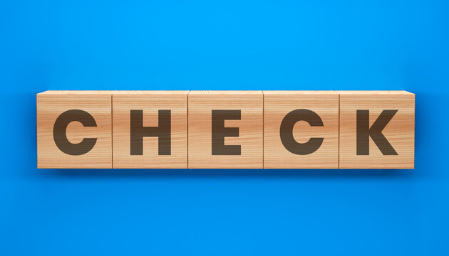 Check Concept on Wooden Blocks: A visual representation of the concept CHECK, spelled out on individual wooden blocks, presented against a clean backdrop, perfect for themes of evaluation.