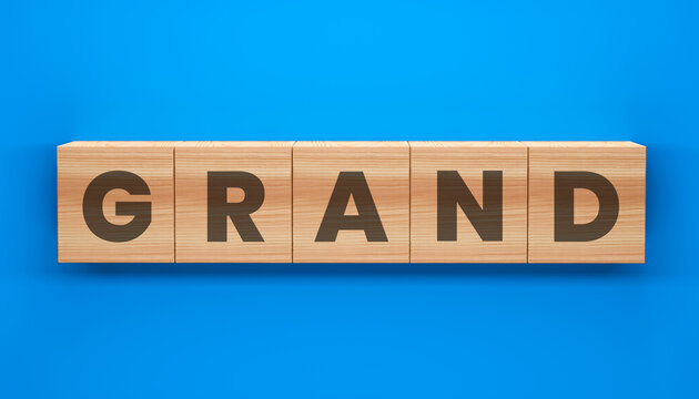 Grand Word Cubes on Blue: Wooden blocks spell out GRAND, offering a sense of scale and importance. Perfect for conveying a message of significance.