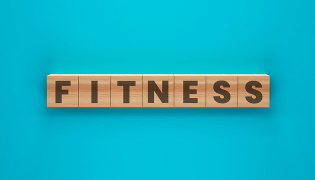 Fitness Defined: A close-up view presents the word FITNESS artfully spelled out on wooden blocks. An eye-catching and inspiring symbol of wellness and vitality.