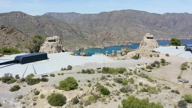 Drone view of the historic Bateria de Castillitos military coastal fortification, featuring the impressive Vickers 381mm naval guns overlooking the Mediterranean Sea in Cabo Ti&ntilde;oso, Spain. 