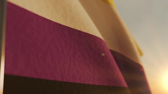 Non binary pride month flag waving in the sky at morning holiday