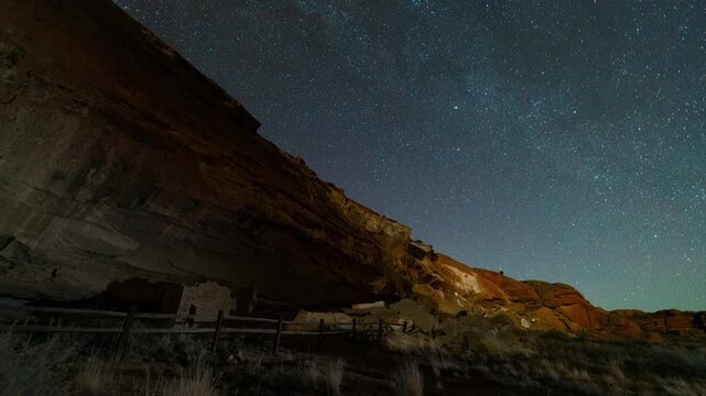 Timelapse of night sky over Native American ruins in Chaco Canyon in New Mexico, USA