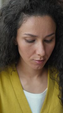 Focused Indian Hispanic woman writing notes pen in library studying female girl student learning homework notebook textbooks knowledge research high school university bookstore writer focus education