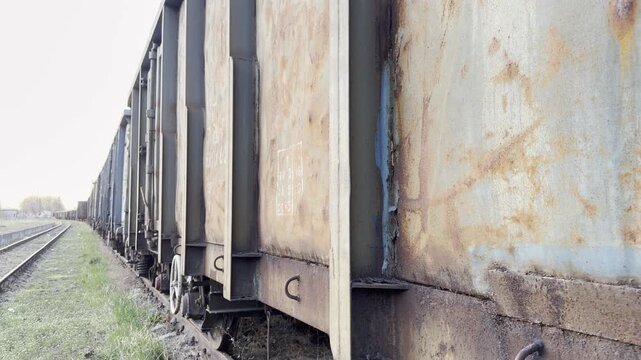 Rusty train wagon peeling paint detail panning
