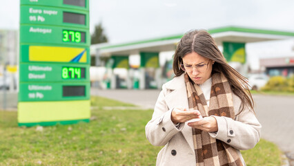 Personal finance pressure woman reviewing fuel purchase © Maksym