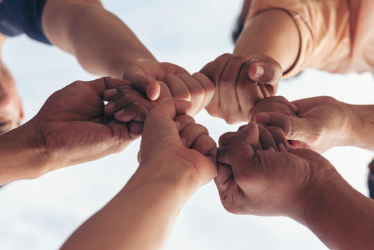 Diversity Teamwork hands stack together trust partner. Businesspeople handshake Leader Trust team handshake promise. MultiEthnics Teamwork high five hands stack shake hands together. Business partner