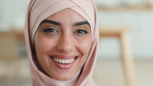Happy joyful Arabian Muslim woman smiling toothy in hijab cheerful female Indian Islamic lady positive fun carefree young adult girl face expression portrait client healthy dental oral health medicine