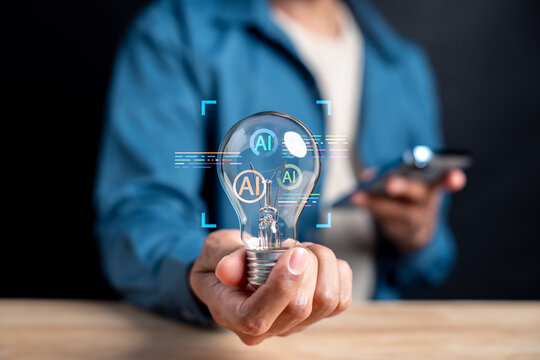 Person holding lightbulb with artificial intelligence digital icon. Machine learning and innovation concept.