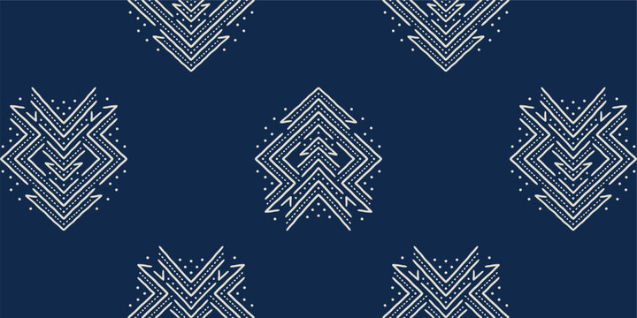 Indigo blue ethnic tribal geometric pattern with white mud cloth chevron motifs and dots