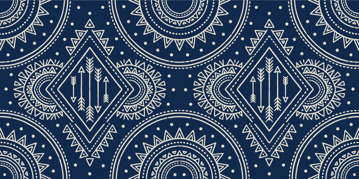Blue ethnic seamless pattern with hand drawn geometric shapes and tribal arrows