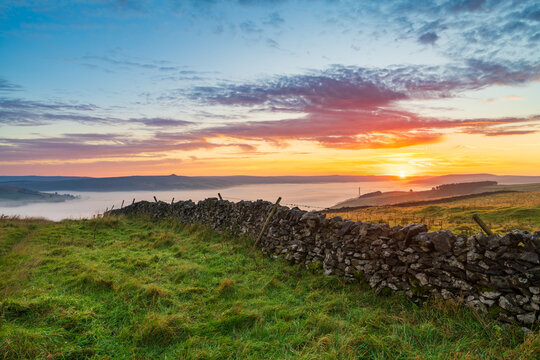 Beautiful sunrise scenery of Peak District with cloud inversion near Castleton. England