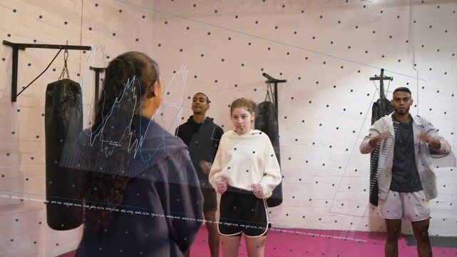 Trainer starting fitness drill, group mirroring jabs with heavy bags, dotted grid tracking form