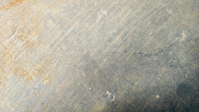 Scratched metal texture background with rust stains and industrial grunge surface. Grungy dark grey concrete texture background with weathered stains.